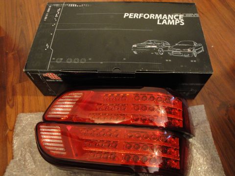 1993 Ford Taurus - Aftermarket LED tail lights are shown next to their packaging, which depicts two car silhouettes.