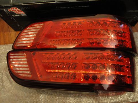 1993 Ford Taurus - A pair of aftermarket red LED tail lights are shown, likely for a modern vehicle.