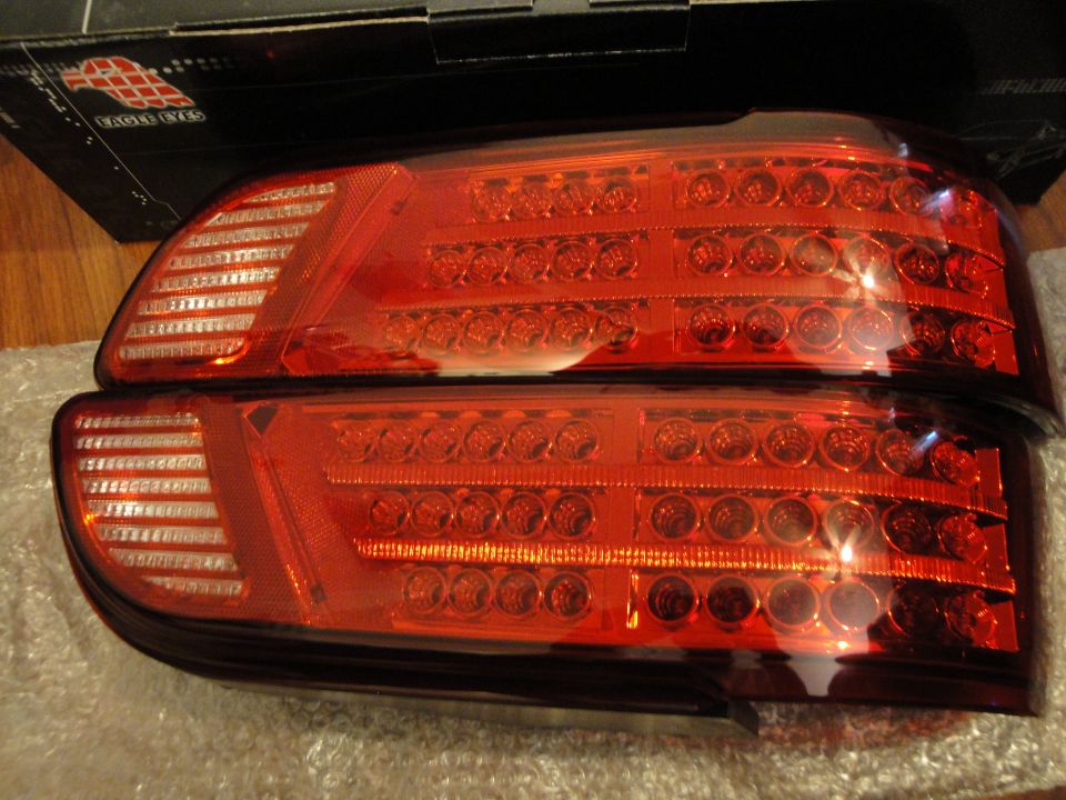 Pair of red LED tail lights with clear turn signal sections