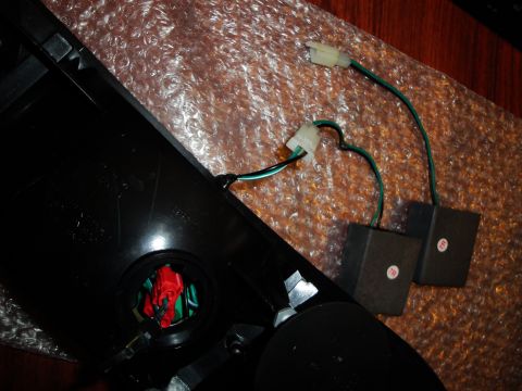 1993 Ford Taurus - A black tail light assembly with visible wiring and two small black boxes is shown.