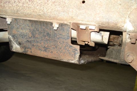 1979 Ford Bronco - Close-up of rusted metal bracket and frame components on a vehicle.