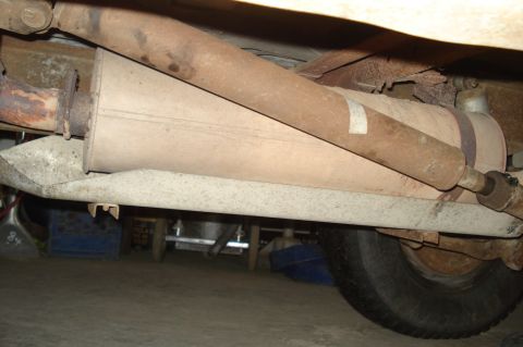 1979 Ford Bronco - Underside view shows the exhaust system and driveshaft of a vehicle.