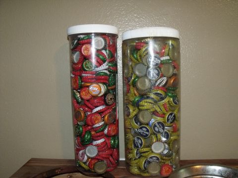 1992 Jeep Cherokee - A collection of bottle caps fills two tall plastic containers, displayed on a wooden surface.