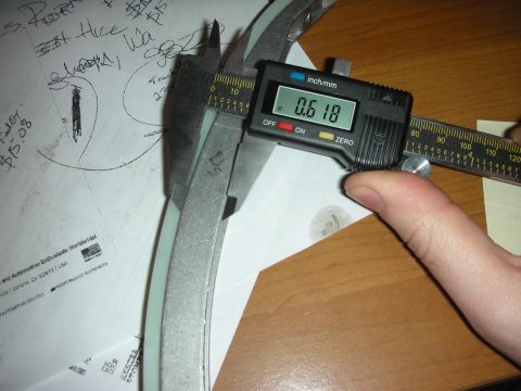 1992 Ford Crown Victoria - A digital caliper measures a component, indicating a dimension of 0.618 inches.