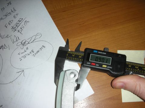 1992 Ford Crown Victoria - Digital caliper reads 0.901 inches on a metal part, with notes including 'Track # 23576448 32001398'.