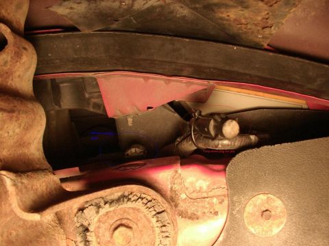 1995 Ford Bronco - Undercarriage view shows various components, including a temperature sensor plug and wiring harness.