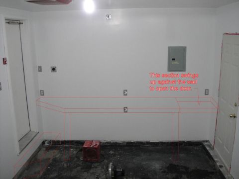 1965 Ford Mustang - A garage interior is shown with red lines indicating a workbench and a door that swings up against the wall.