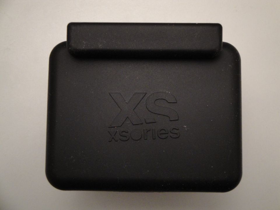 Black plastic case with embossed 'XS xseries' text, viewed from above