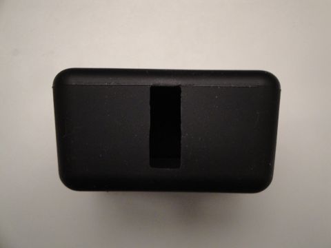 1993 Ford Taurus - A close-up view of a black plastic component with a central slot.