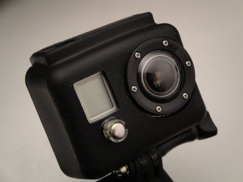 1993 Ford Taurus - Close-up view of a black action camera, likely a GoPro, showing its lens and display screen.