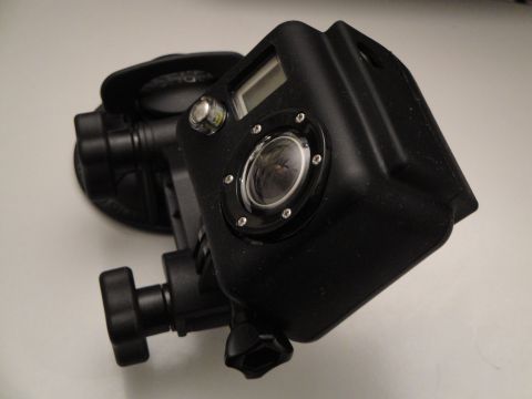 1993 Ford Taurus - This is a close-up view of an action camera mounted in a waterproof housing.