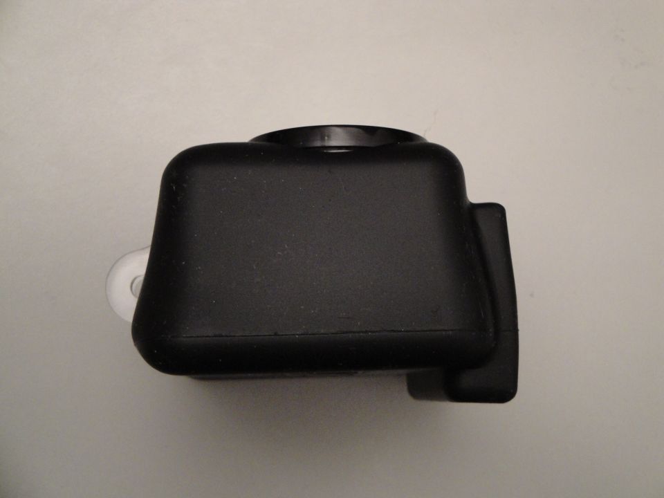 Black camera housing with a white loop attachment