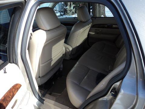 2004 Mercury Grand Marquis - The spacious interior of a 2004 Mercury Grand Marquis LS features comfortable leather seats and wood trim accents.
