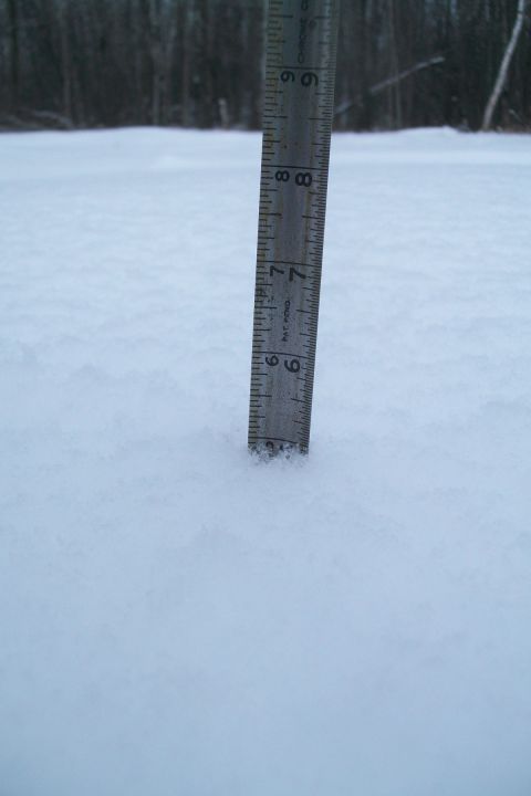 2000 Chevrolet Tahoe - A ruler is used to measure the depth of snow in a winter scene.