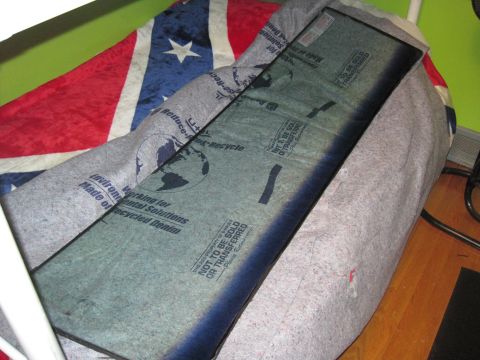 1979 Ford Bronco - A windshield is shown covered in protective material, revealing text and graphics related to recycling and product transfer.
