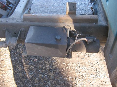 1972 Ford F-250 - The underside of a truck shows a fuel tank and associated plumbing attached to the frame.