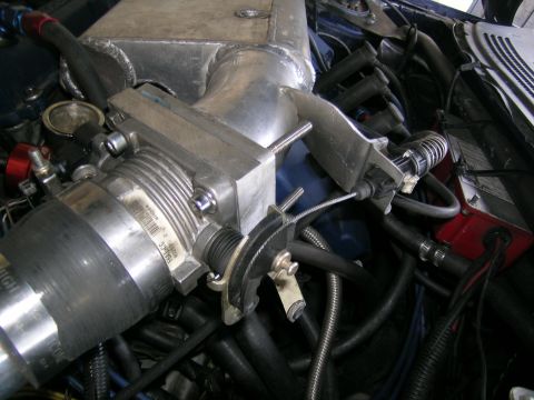 1995 Ford Probe - This image shows a detailed view of an engine's air intake system, including the throttle body and associated components.