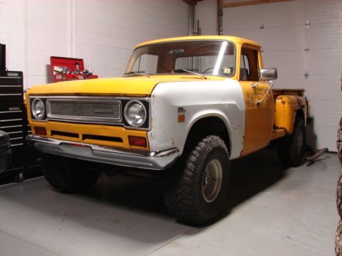 1971 International School Bus - This International pickup truck, likely from the early 1970s, is shown in a garage with a two-tone paint scheme.