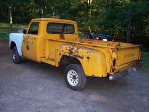 1971 International School Bus - This pickup truck appears to be from the early 1960s, with significant rust and a mismatched fender.