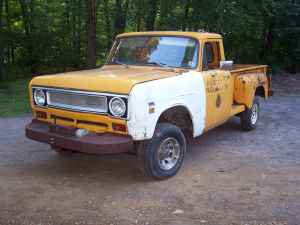 1971 International School Bus - This International pickup truck has a two-tone paint job and appears to be in a state of disrepair.