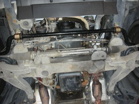 2004 Ford Crown Victoria - The undercarriage of a 2004 Ford Crown Victoria displays an installed sway bar and steering components.