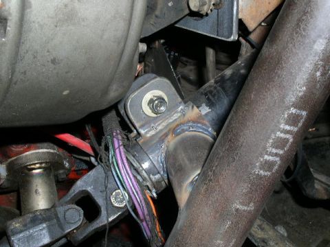 1979 Ford Bronco - Custom welded bracket with wiring harness attached, part of a vehicle's mechanical system.
