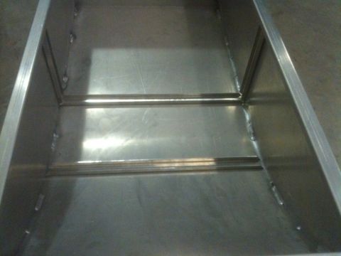 1986 Chevrolet Blazer - Interior of a metal box with visible support bars and welded seams.