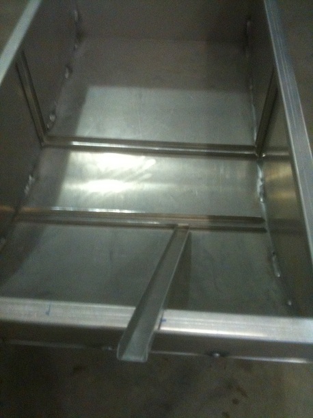 1986 Chevrolet Blazer - This image shows the interior of a metal box with visible support beams and a small angled piece, possibly a part of a larger structure.