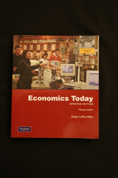 1993 Ford Taurus - This is the cover of the book "Economics Today, Updated Edition, Fifteenth Edition" by Roger LeRoy Miller, published by Pearson.