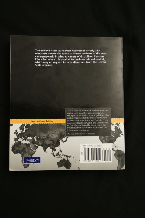 1993 Ford Taurus - This is the cover of a book, likely an international edition from Pearson, a world map.