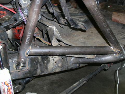 1979 Ford Bronco - Close-up view of custom roll cage fabrication on a vehicle chassis.