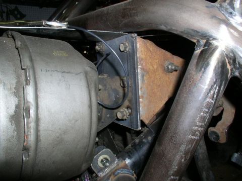 1979 Ford Bronco - Custom fabrication work on a vehicle frame, showing a large cylindrical part and metal tubing.