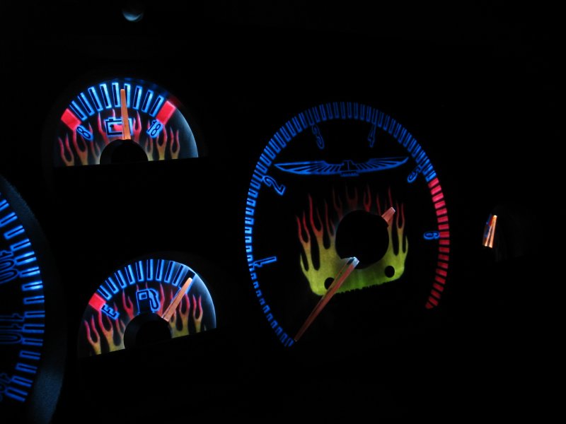 Custom flame gauge cluster with blue backlighting and red needle