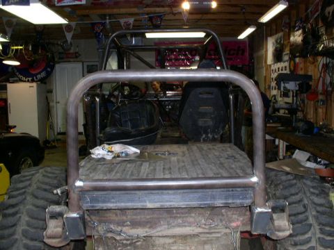 1979 Ford Bronco - This heavily modified vehicle features a prominent roll cage and oversized tires, suggesting it is built for off-road use.