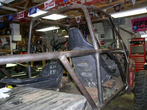 1979 Ford Bronco - Interior view of a custom-built off-road buggy under construction in a garage.