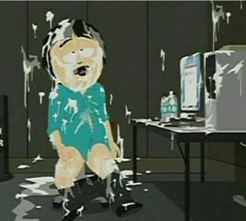 1990 Chevrolet Suburban - A man is covered in a white substance while sitting on a toilet in front of a computer.