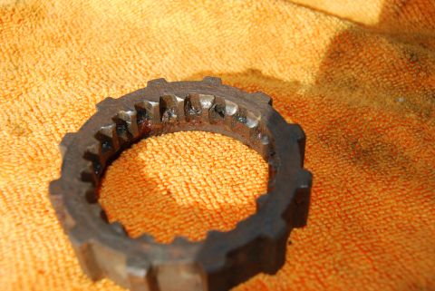 1982 Ford Bronco - This worn gear part shows significant damage to its teeth, indicating it may need replacement.