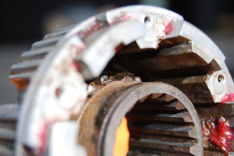 1982 Ford Bronco - A close-up view of a damaged differential gear, showing signs of wear and tear.
