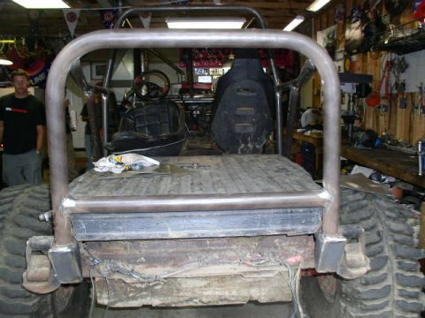 1979 Ford Bronco - This custom off-road vehicle features a prominent roll cage and oversized tires, suggesting significant modifications from its original for…