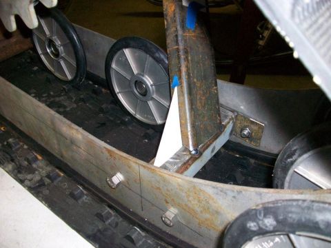 1987 Suzuki Samurai - Close-up view of the internal components of a snowmobile track system, showing wheels and suspension.
