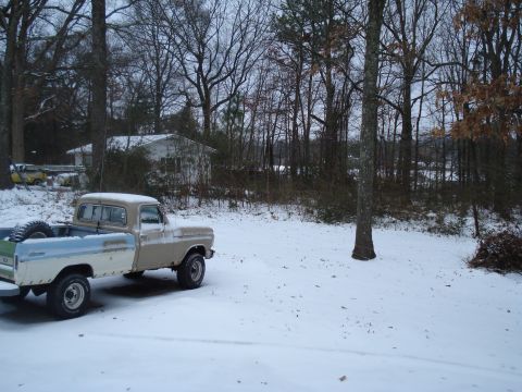 1994 Ford F-350 - Pickup truck sits in a snowy yard with a house and trees visible in the background.