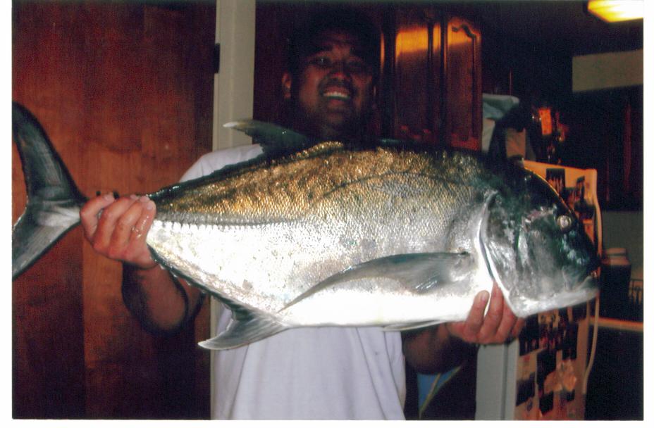 My bother in law Ryan Tambalo and his 27lb Ulua he caught diving.
