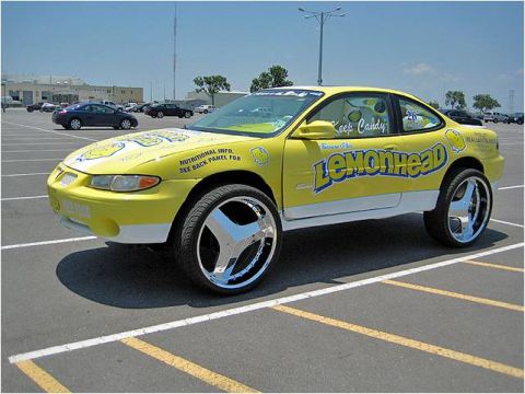 1972 Ford Ranchero - This modified car features "Lemonhead" candy branding and oversized chrome wheels.