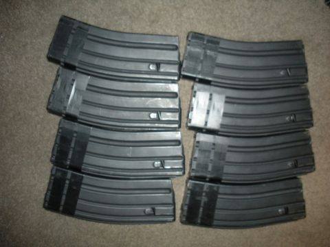 1996 Ford Bronco - Several AR-15 magazines are piled on a carpeted surface.