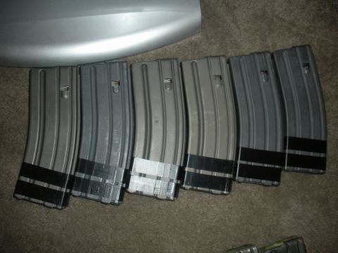 1996 Ford Bronco - Several rifle magazines are laid out on a carpeted surface.