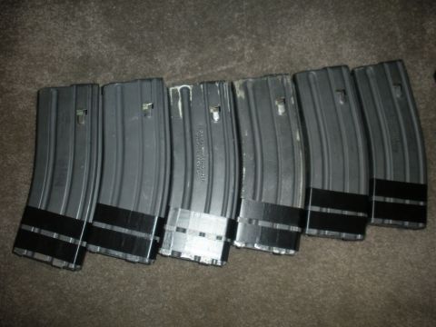 1996 Ford Bronco - Several AR-15 magazines are laid out on a carpeted surface.