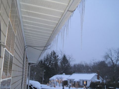 2004 Aston Martin Virage - Winter scene with icicles hanging from the eaves of a house.