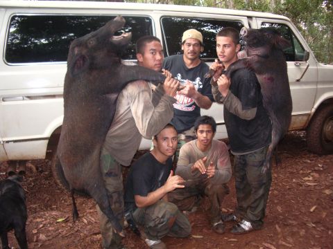 1991 Ford Bronco - Hoppy in middle standing, Josh with hog on left, Sean with hog at right, Daylan kneeling at right with friend kneeling at left.