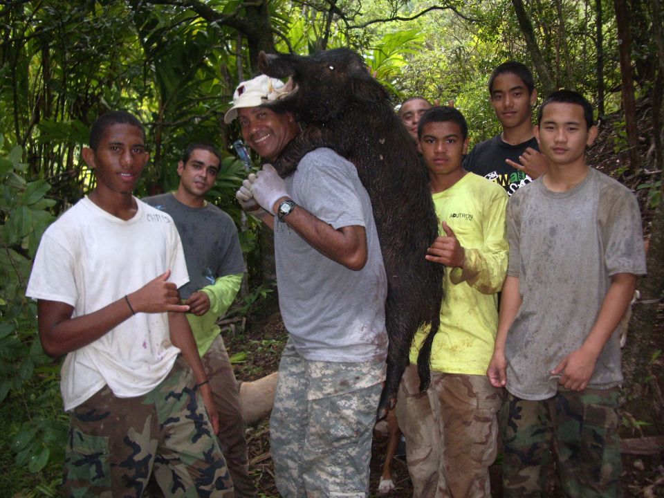 A guest with his son at left with Tony, Chris, Ikaika, Rivers and DJ. This gentleman just came back from Iraq and retired and they took him hunting for miles and he hung step for step  with the young bucks! Not bad for his very first time hog hunting.