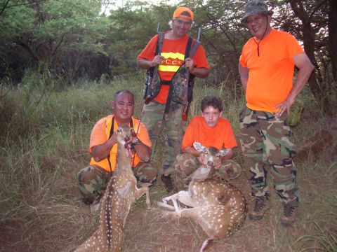 1991 Ford Bronco - Four hunters pose with two deer after a hunt.